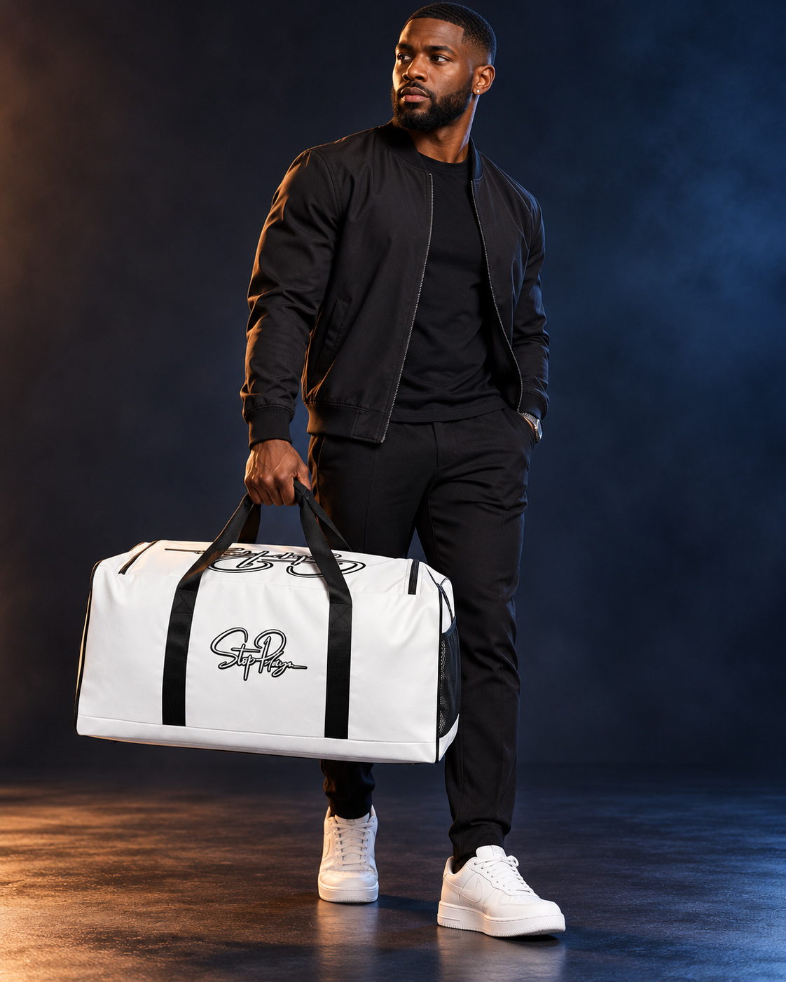 Adult model carrying the white StopPlayn Duffle Bag